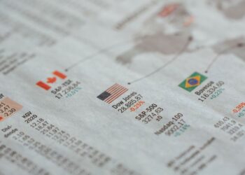 Gazete sayfasında yer alan Dow Jones ve S&P gibi borsa verileri.